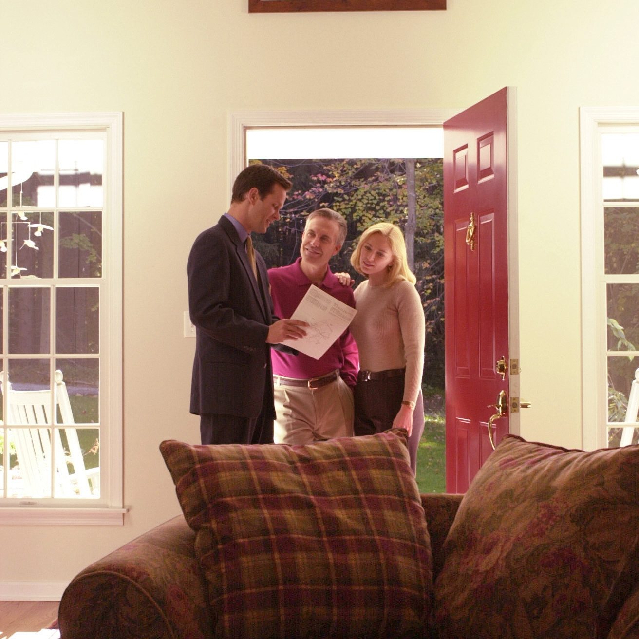 Buyers & Agent in Doorway